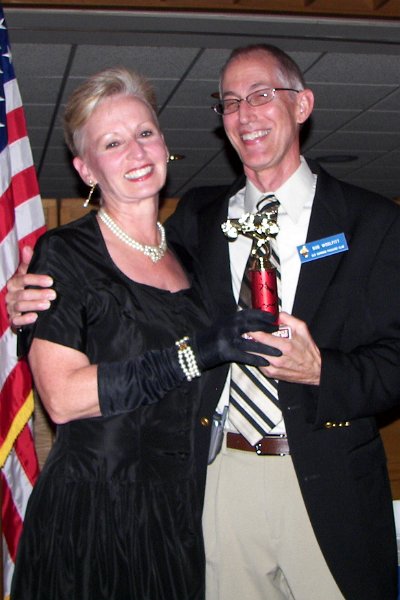 100_2136.jpg - Bob and Shirley get the long distance pre-war award
