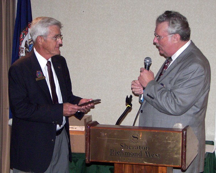 100_3925.jpg - Bill Pettit receives a special award for designing dash plaques and license plates for the ODPC for many years