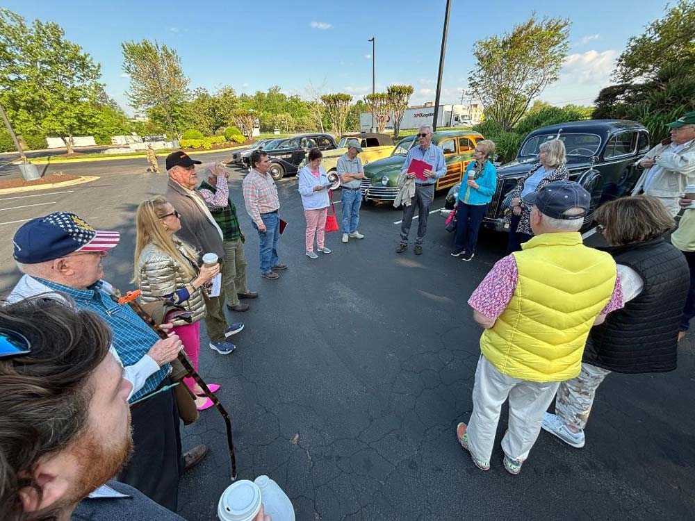 06.jpg - Jon Hatfield, center, organizes members before they leave the hotel on Thursday morning.