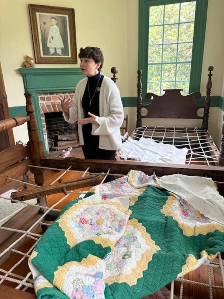 82.jpg - The Weston tour guide discussed the bedding at Weston Manor. 